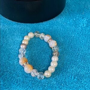 Elegant Pearl and Crystal Bracelet with light orange accents